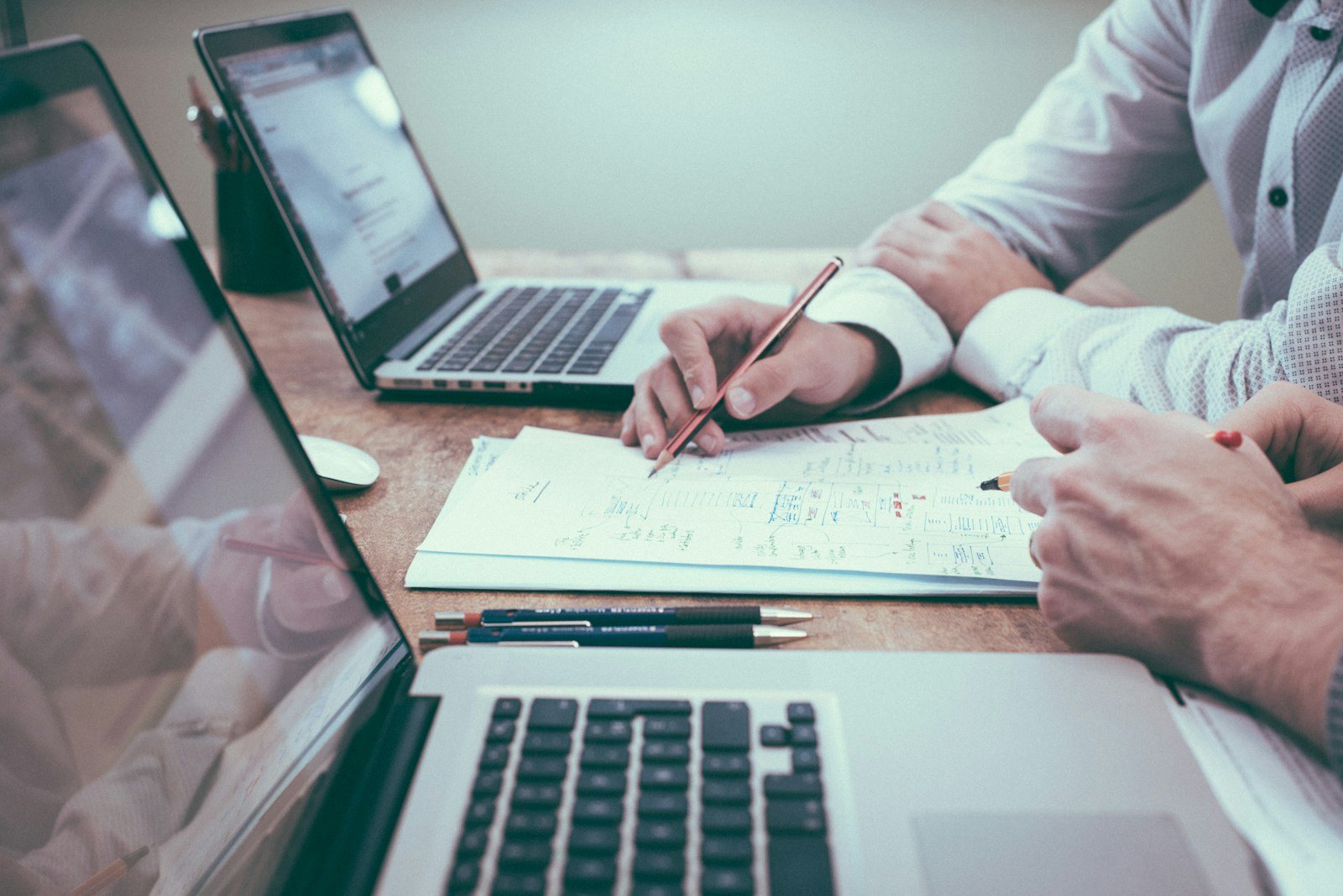 Advisers reviewing figures together over a desk